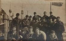 Henry “Harry” J. Trussell, top row, under the flag.